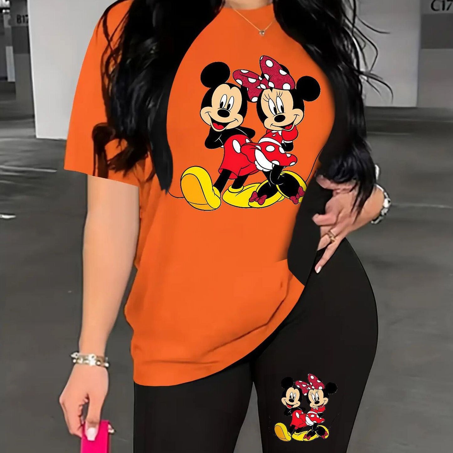 A Two-Piece Outfit Featuring a Printed Short-Sleeve T-Shirt with Dropped Shoulders And Cropped Leggings, Designed for Plus-Size Women, Licensed with Mickey And Minnie.