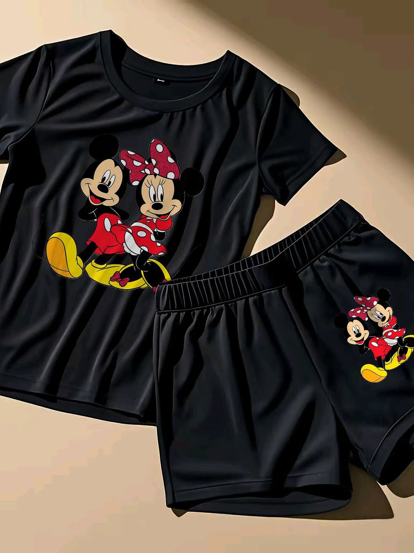 A Two-Piece Outfit Featuring a Printed Short-Sleeve T-Shirt with Dropped Shoulders And Cropped Leggings, Designed for Plus-Size Women, Licensed with Mickey And Minnie.